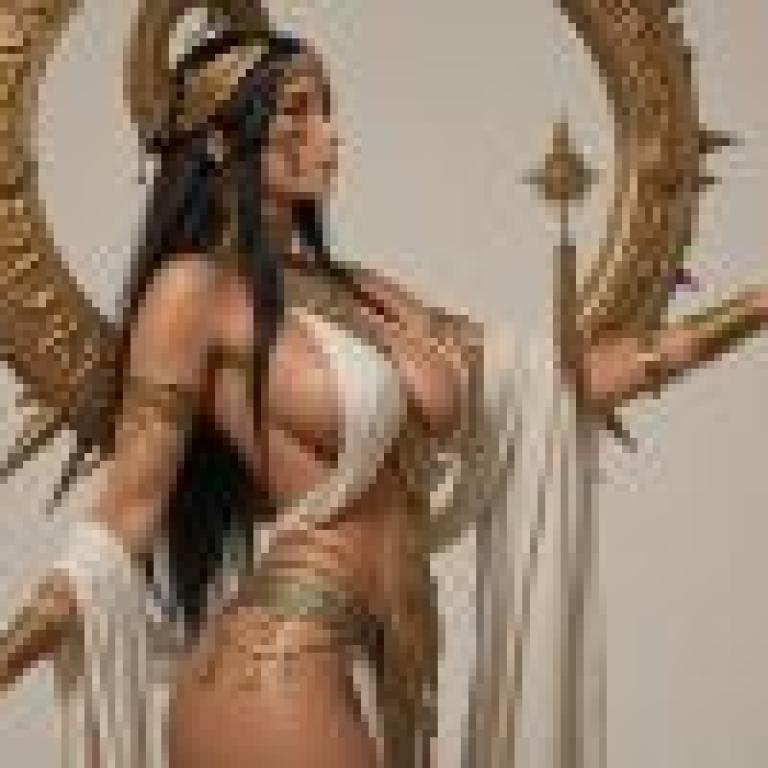 Egyptian goddess，Gold and white female statue with outstretched hand.