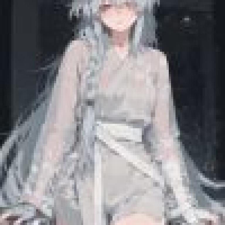 girls，A girl with an eye ring and white hair in braided pigtails is wearing a grey outfit.