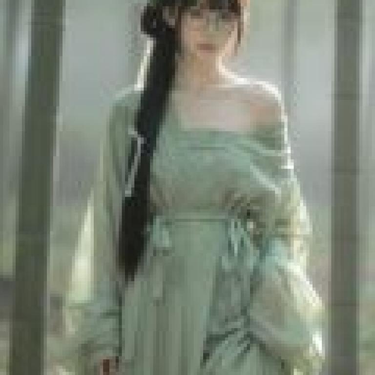 Beauty in the book，A woman wearing a green dress.