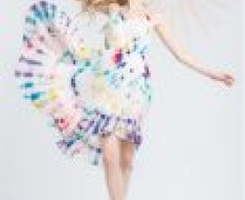 ZIT ATR，A blonde girl wearing a tie die dress.