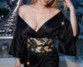 girls，A model wearing a black kimono with gold tassels.