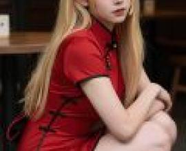 ZIT 01，A young woman in red is sitting down.