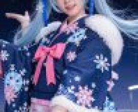 Hatsune Miku，Blue haired girl wearing blue dress with white snowflakes on it.
