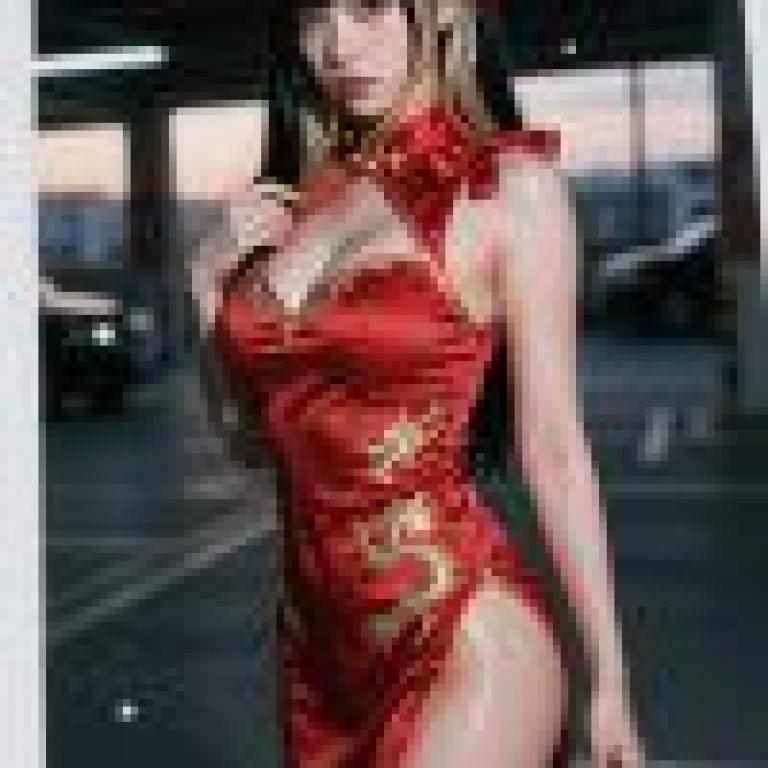 girls，A woman in red Chinese clothing is posing outdoors.