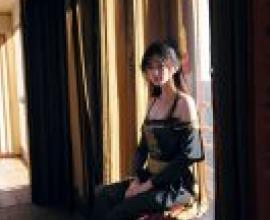 KyokofukadaThe woman on the balcony with red hair.