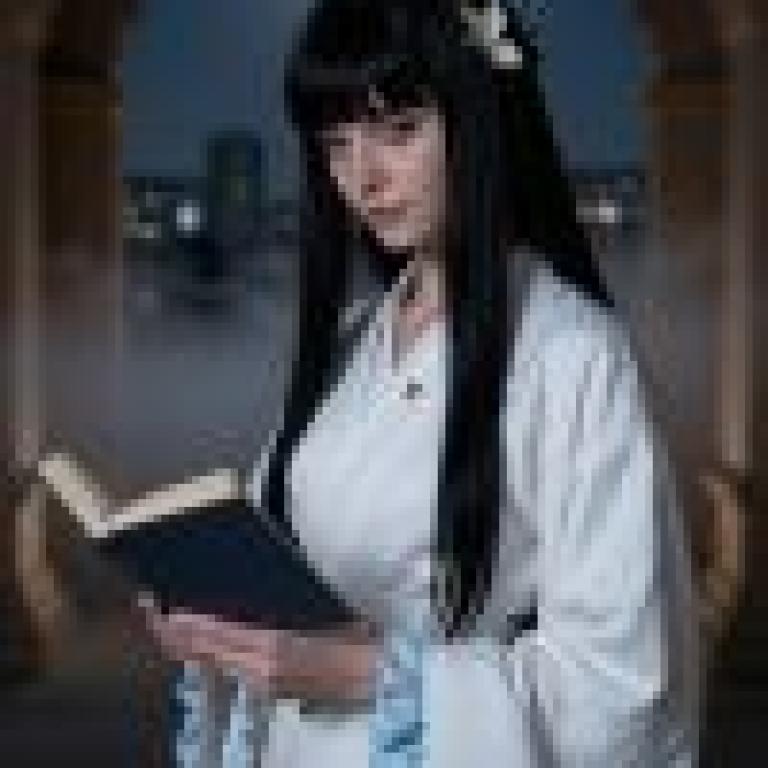 girl，A woman with long black hair reading a book.