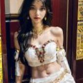 Egyptian Goddess，A woman with long black hair wearing gold jewelry and a white dress.