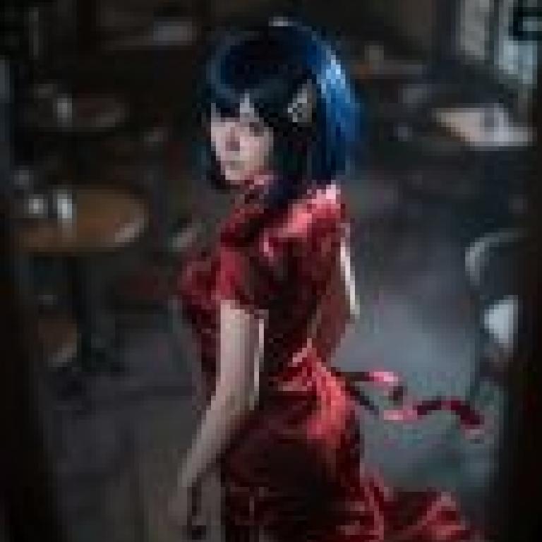 Photographers，A woman in red dress looking at the mirror.