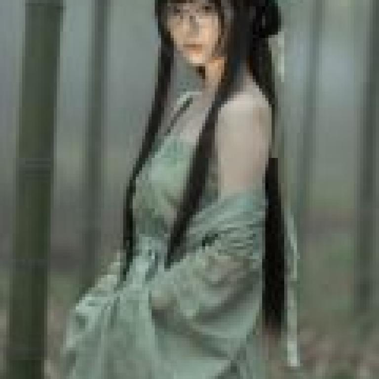 Beauty in the book，A woman in a long sleeved green dress.