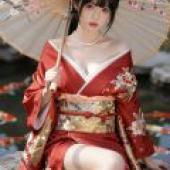 Cherry blossoms and kimonos，A girl wearing red kimono.