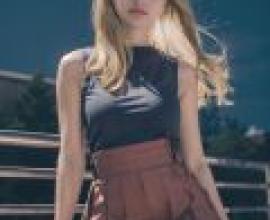 瑟蕾娜，寶可夢，一位穿著黑色洋裝的漂亮女孩。