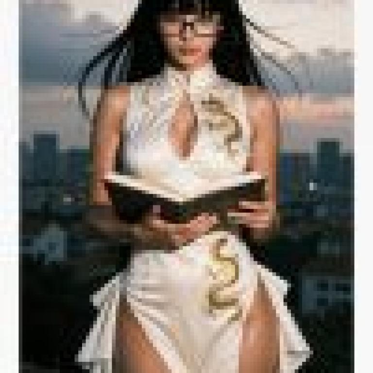 girls，A woman in a white dress reads a book while wearing glasses.