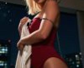 Ancient sexiness，A blonde woman is wearing a red dress and holding a white towel.