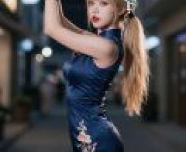 Korean girl working in Shanghai，A woman wearing blue dress is dancing.