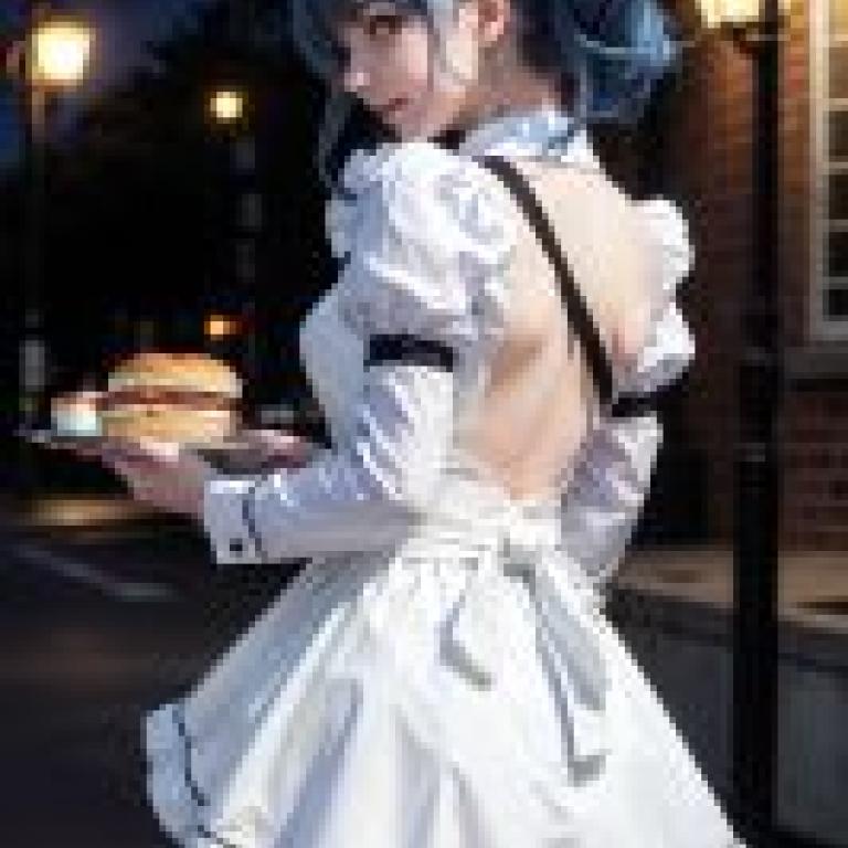 FloatingPlanet Celestial Septagram PlanetWaitress wearing a white dress.