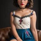 Mirabelle Marig， Encanto，Woman wearing a red necklace.