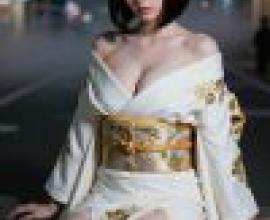 kimono，Model in dress and bow sitting on ledge.