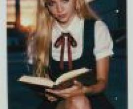 Uniform Story，Model of woman sitting and reading book.