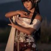 Exotic，The woman is wearing a dress.