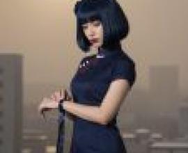 Magazine cover，Blue dress with bow on front and hair with dark bangs.