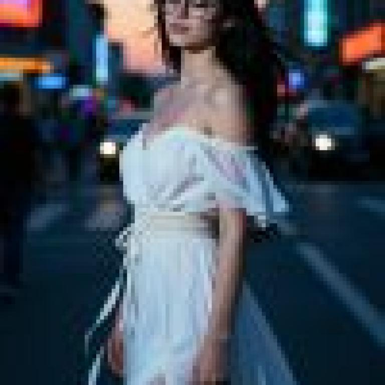 Dance of the Night，A woman with long hair wearing glasses.