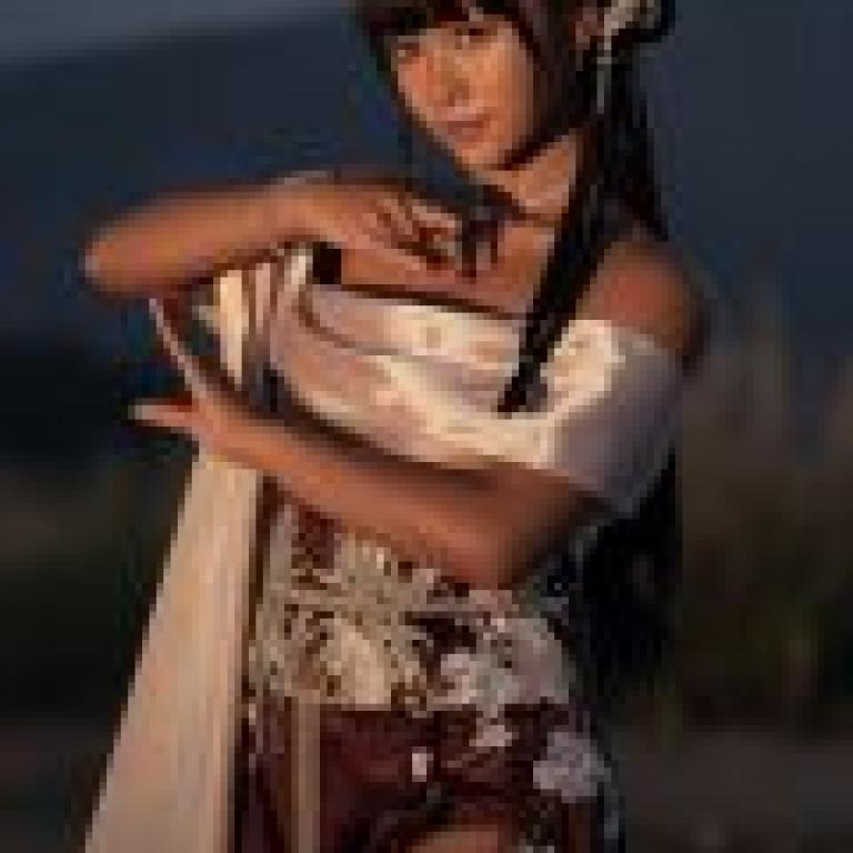 Exotic，The woman is wearing a dress.
