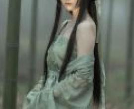 Beauty in the book，A woman in a long sleeved green dress.