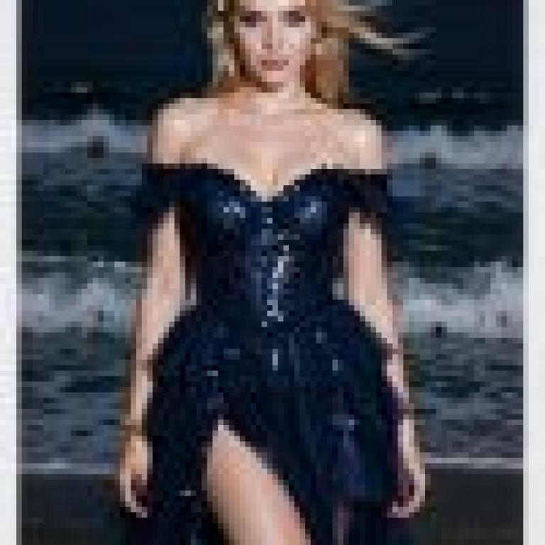 girls，A blonde woman in a blue gown on the beach.