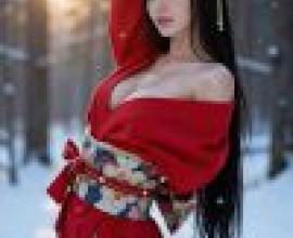 girls，A woman wearing red stands in the woods.