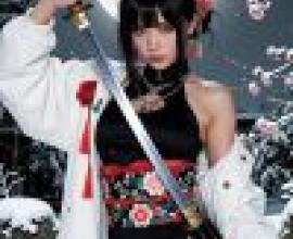 kimono，Asian woman holding a sword and wearing a black dress with red trim.