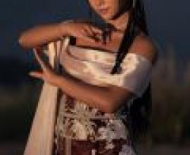 Exotic，The woman is wearing a dress.