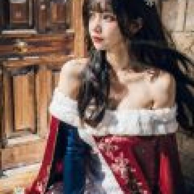 Snowflakes in the Icy Illusion，A girl sitting down with a santa hat and looking at the camera.