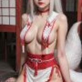 Fox Fairy Girl，A woman in red and white lingerie sits on a bench.