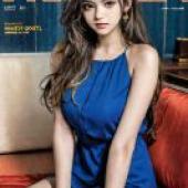 Indian beauty，A girl sits on a sofa with a copy of Vogue China Magazine open in front of her.