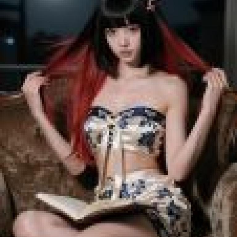 The Road of Art，A girl in front of a chair holding a book.