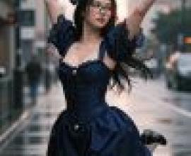 girls，A woman in blue dress is dancing.