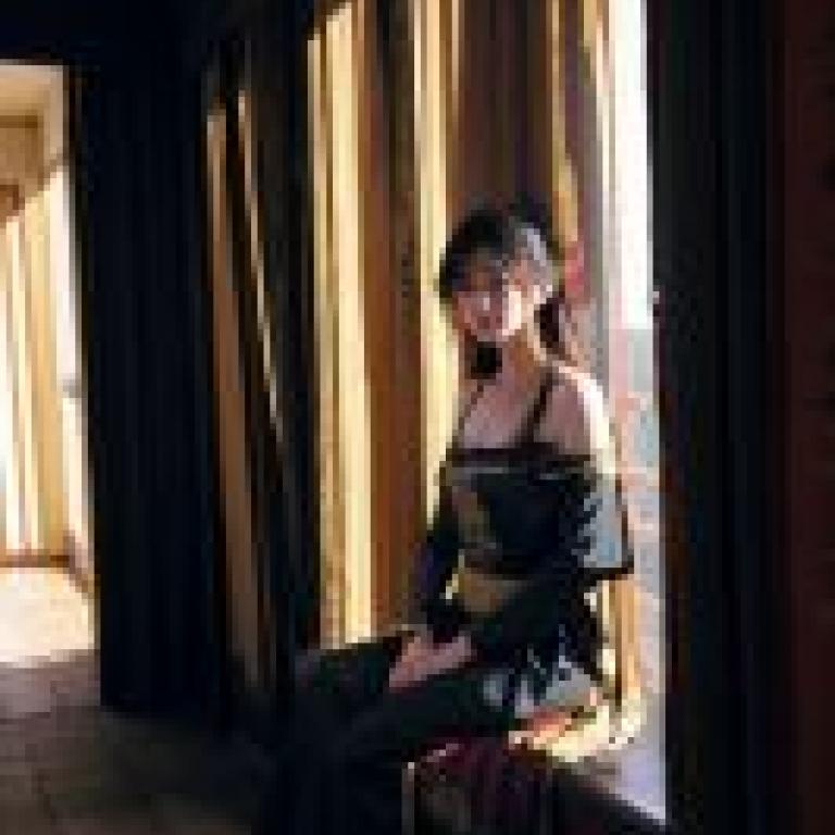 KyokofukadaThe woman on the balcony with red hair.