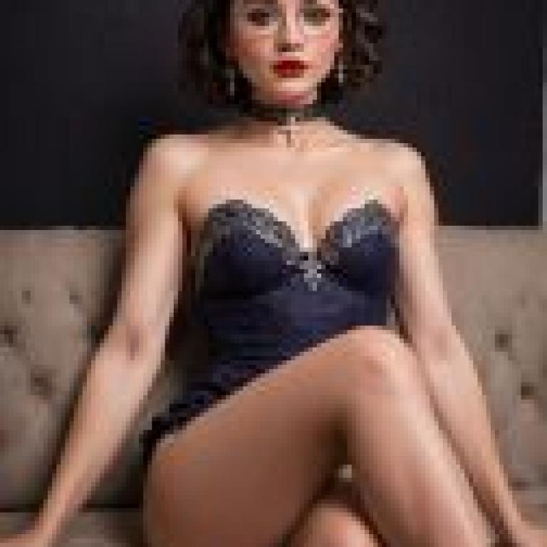 Mirabelle Marig， Encanto，Woman sitting on couch.