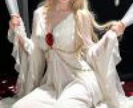 gorgeous，A blonde beauty in a white dress with red flowers.