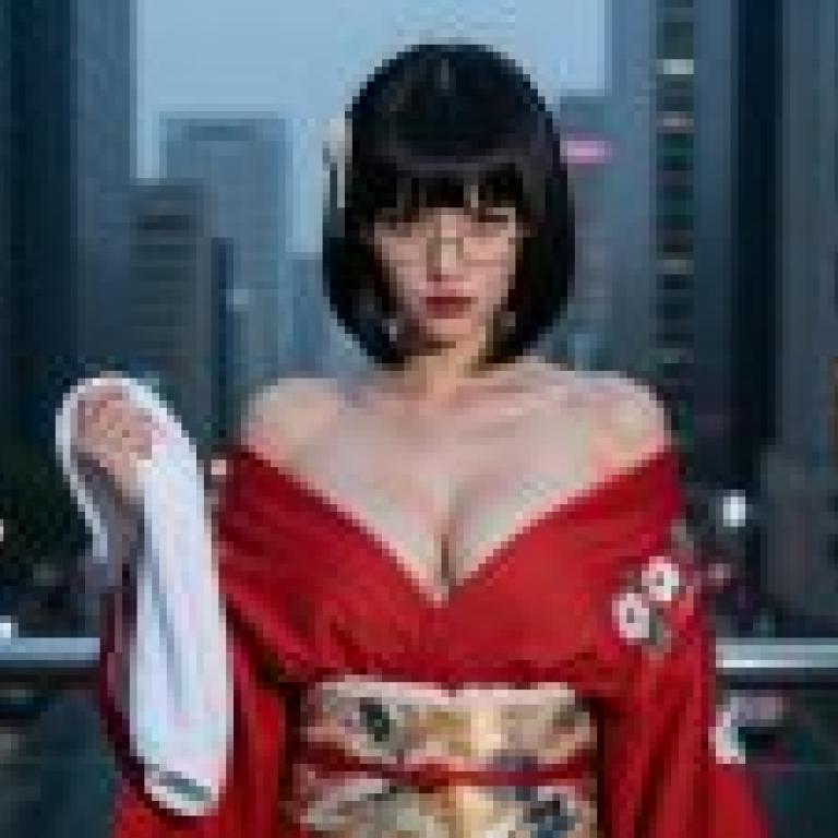 Street photography，Asian woman with red dress holding a towel.