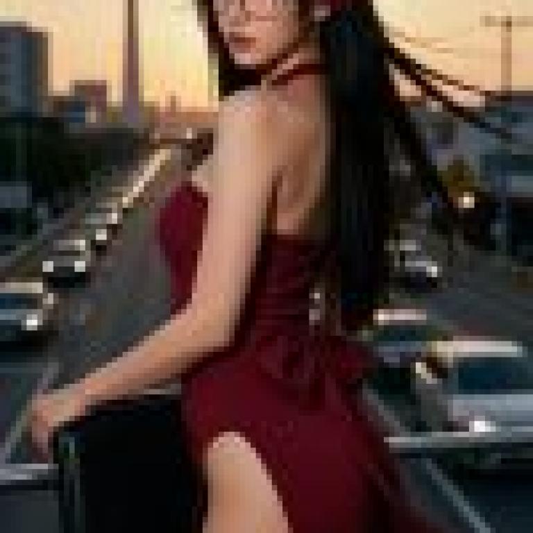 Red Temptation，A woman standing by a road full of cars.