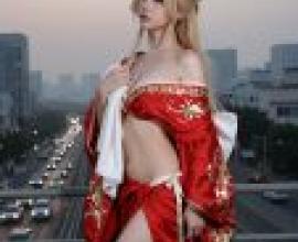 Time passed，A model of woman wearing red dress with gold design.